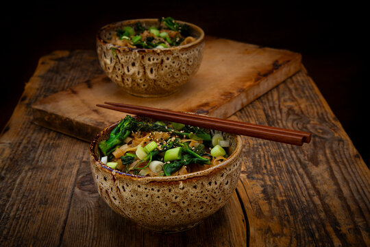 Quick miso noodles with baby broccoli in a ceramic bowl