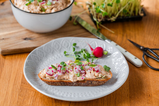 Traditional Bavarian Obazda cheese spread on bread with radish