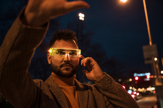 Man with smart glasses at night
