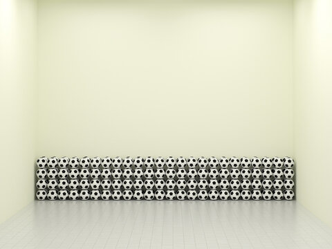 Stack of soccer balls stored in an empty minimal room