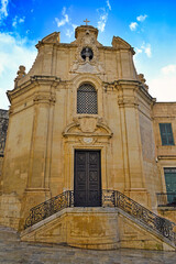 Fototapeta premium Baroque facade of Church of Our Lady of Victory with ornate staircase in Valletta Malta