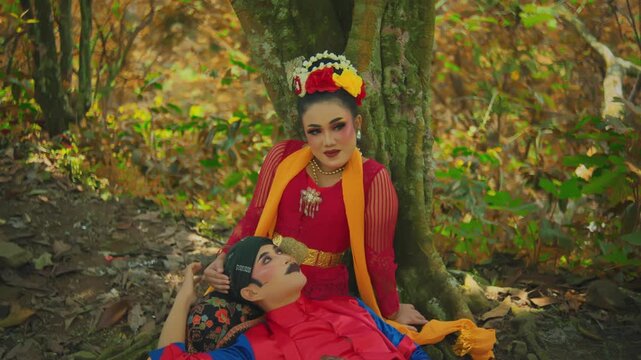 Intimate Moment of Traditional Couple Under Tree