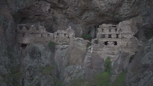 Cinematic Aerial View of Alicin Monastery Caves in &Ccedil;amlıdere Ankara Turkey Ancient Cliffside Roman Era Hidden Landmark