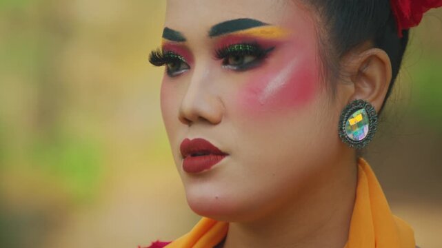 Beautiful Indonesian Dancer Staring Intently with Vibrant Makeup