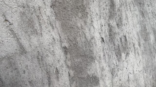 Raw rough concrete plaster surface on new construction wall