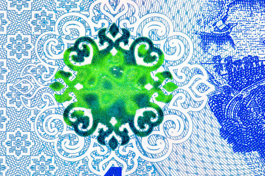 national crest and the face value number 1 on a Brunei 1 Dollar banknote. textures on polymer currency from Negara Brunei Darussalam