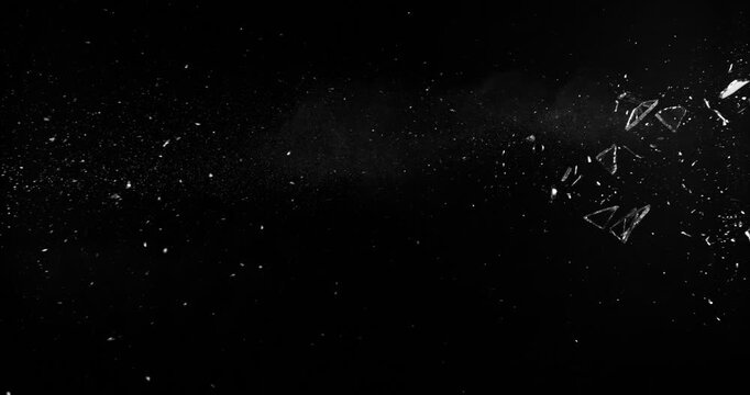 Super Slow Motion of Shattered Glass Isolated on Black Background. Break Glass from the Gunshot. Filmed on High Speed Cinema Camera, 1000 fps.