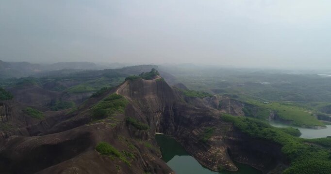 Aerial View of Rocky Mountain Cliffs and Green Valley Lakes