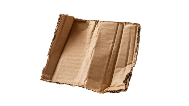 Isolated crumpled and torn brown corrugated cardboard sheet for packaging or textured design
