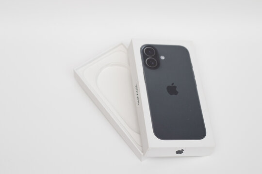 box of brand new black Apple iPhone 17 on white background. New York, USA - May 5, 2026