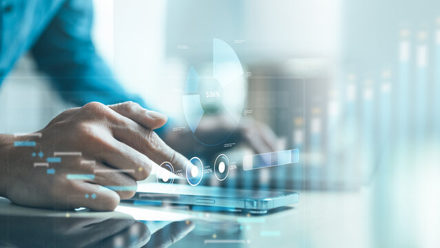Hand using smartphone with digital analytics dashboard, showing big data, business intelligence, AI analysis, software system, and technology management concept.