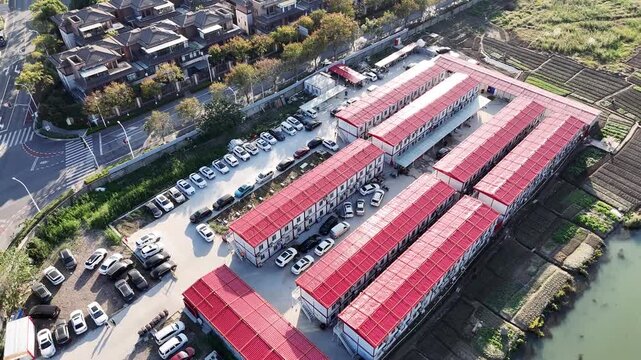 Red Roof Modular Housing Complex Beside Waterway