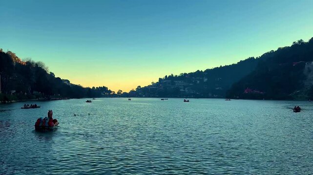 Scenic Lake View of Nainital with Colorful Boats Floating on Water