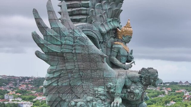 Garuda Wisnu Kencana Statue Overlooking Bali Under Cloudy Sky in Garuda Wisnu Kencana Cultural Park, Bali, Indonesia