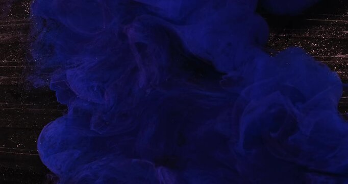 Blue paint background. Color fog water. Defocused navy chemical splash pigment wet texture fluid spill on art glitter dark black abstraction.