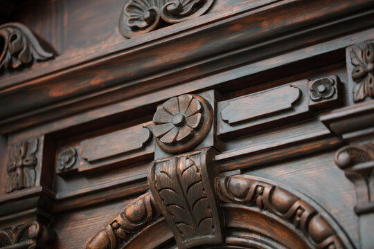 Carved wooden rosette and acanthus leaf ornament on historic door, architectural detail. Odesa Ukraine