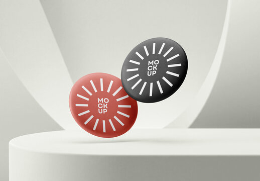 Two Round Matte Dark and Red Pin Badge Button Mockups Floating on White Studio Pedestal for Brand Display
