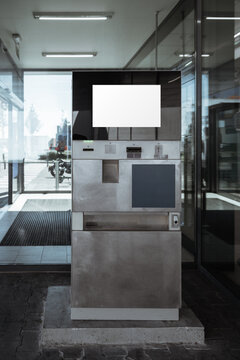 Metal parking payment machine with blank white display at supermarket exit, urban self service kiosk mockup for pay station, ticketing and interface design
