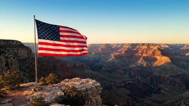 Iconic American flag dramatically unfurls against a glorious sunset sky over a vast canyon, embodying the enduring spirit of independence for 4th of July