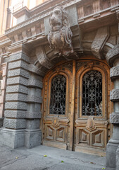 Obraz premium Ornate Wooden Door with Stone Carving