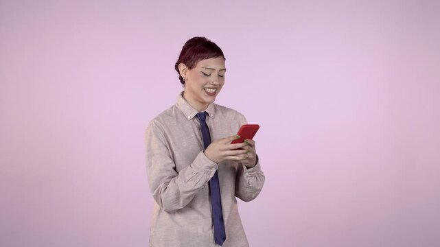 Androgynous woman with short hair using a mobile phone