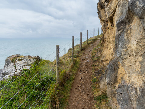 Great Orme cliff path with fencing overlooking West Shore