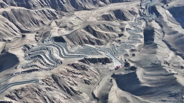 Winding Mountain Road Through Arid Desert Landscape