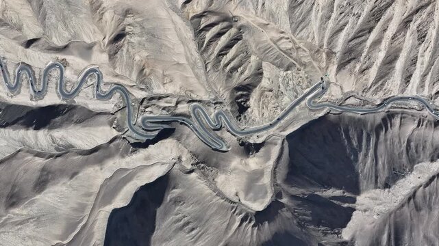 Winding Mountain Road Through Arid Desert Landscape