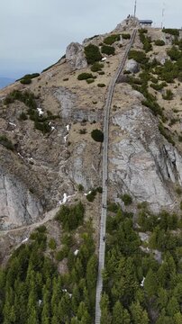Toaca staircase aerial drone view on rocky cliff spring