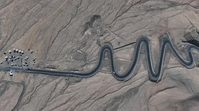 Winding Mountain Road Through Desert Landscape
