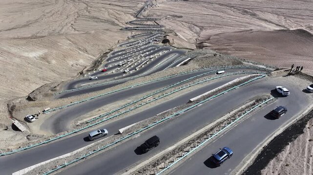 Winding Desert Mountain Road with Cars