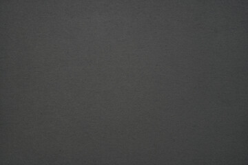 Dark grey abstract background providing a subtle texture for copy space and design elements © Floren Horcajo
