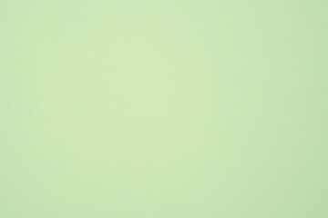Fototapeta premium Pale green paper showing a smooth surface with subtle texture