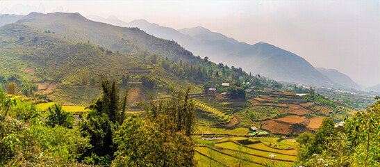 Fototapeta premium A view of terraced hillsides in northern Vietnam near Sapa in the early morning