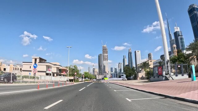 View from a car driving through downtown Dubai city, United Arab Emirates