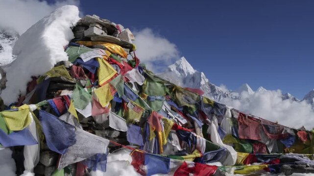 Prayer flags at Thukla Pass with Ama Dablam peak in Himalayas, Nepal