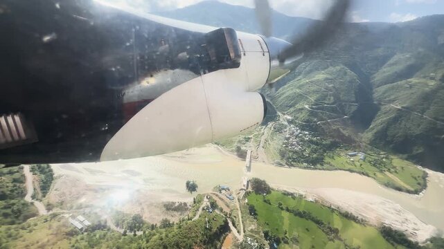 Flight over Sun Koshi river and Himalayan foothills in Nepal