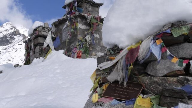 Stone chortens at snowy Thukla Pass memorial in Nepal
