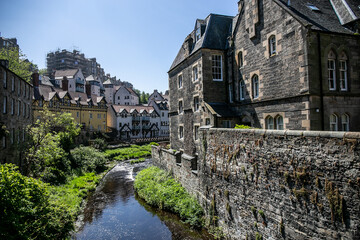 Fototapeta premium View of Dean Village in Edinburgh, showing the historic riverside neighbourhood along the Water of Leith. Once a thriving milling district for over 800 years, the area is now a residential quarter