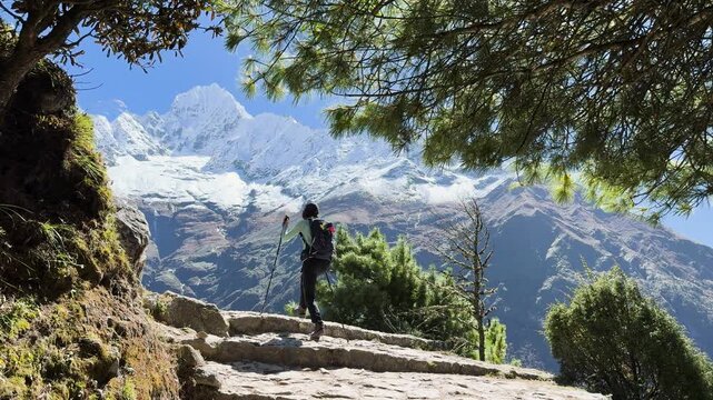 Woman hiker on Everest Base Camp trail in Himalayas, Nepal