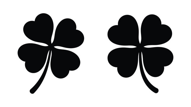 Four leaf clover silhouettes on a white background