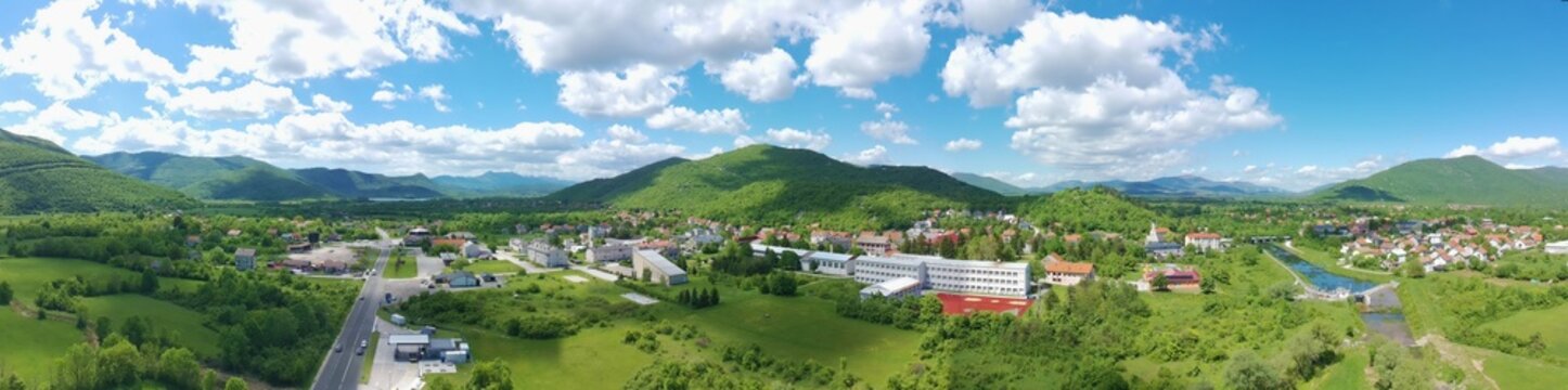Panoramic aerial view of Gračac town surrounded by green mountains in Croatia