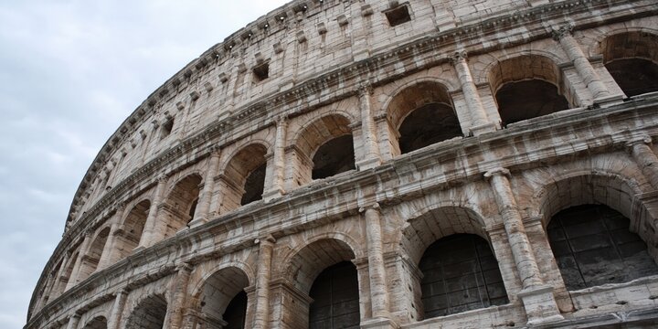 Photo of Roman colosseum with ancient architectural design 
