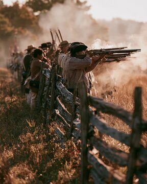 Medium shot of diverse reenactors standing in a line behind a weathered splitrail fence each holding muskets raised smoke swirling in a sunlit open pasture with cinematic lighting.