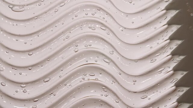 Transparent skincare cosmetic gel texture footage. Moisturising waves cream texture motion with spatula. Body care light creamy beauty product smudge closeup. Advertisement of a cosmetic product. 4k