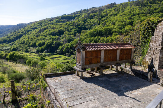 Traditional espigueiro granary building in rugged mountain landscape