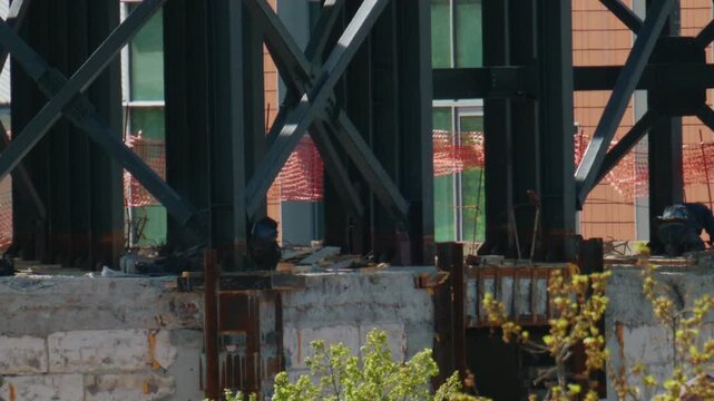 Close up view of steel beams and structural supports on an active construction site