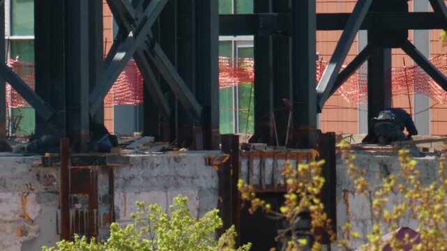 Close up view of steel beams and structural supports on an active construction site