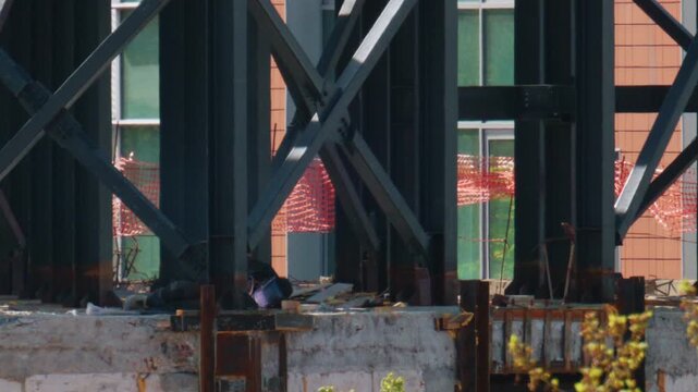 Close up view of steel beams and structural supports on an active construction site