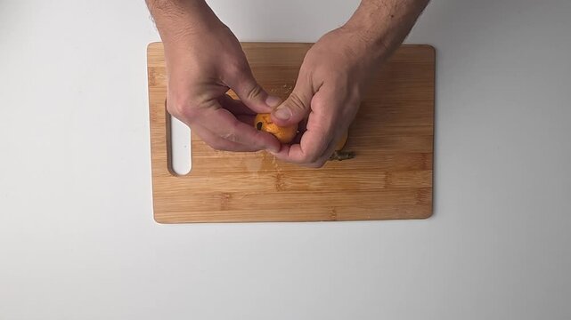 Hand holding loquats. Yellow fruit hand. medlar in hand, close-up. High quality photo